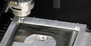 Engraving Receptacle Plate with Vegetable Oil Based Lubricant.